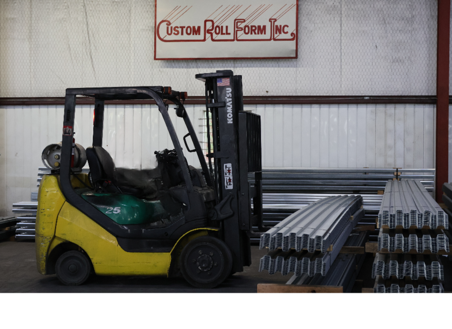 Custom Roll logo with a forklift carrying products